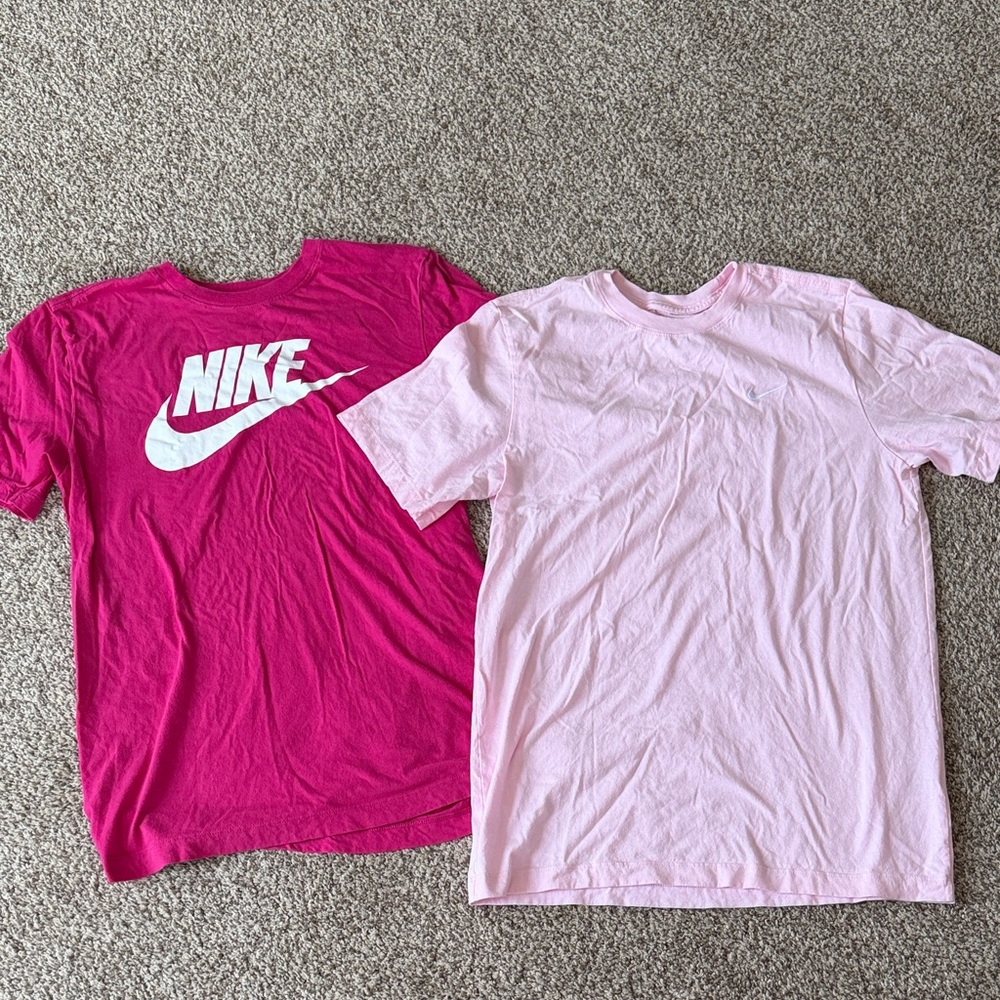 Nike Kids XL pink tees. Like new condition. Price is for both tees